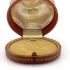 Antique Cartier leather jewelry presentation box with gilded garland border and silk velvet interior