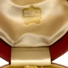 Antique Cartier leather jewelry presentation box with gilded garland border and silk velvet interior