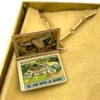 1939 New York Worlds Fair bracelet with miniature book charm souvenir album in original box