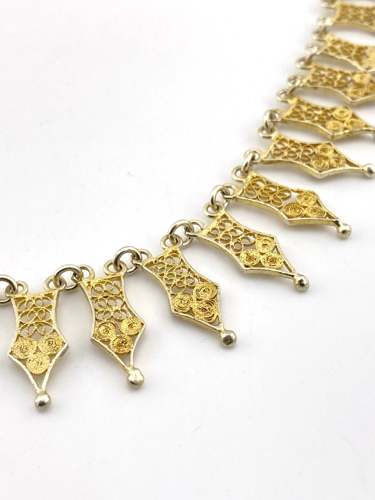 Vintage filigree link necklace with gold and silver tone spear shaped links 17 inch