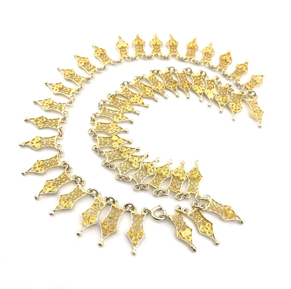 Vintage filigree link necklace with gold and silver tone spear shaped links 17 inch