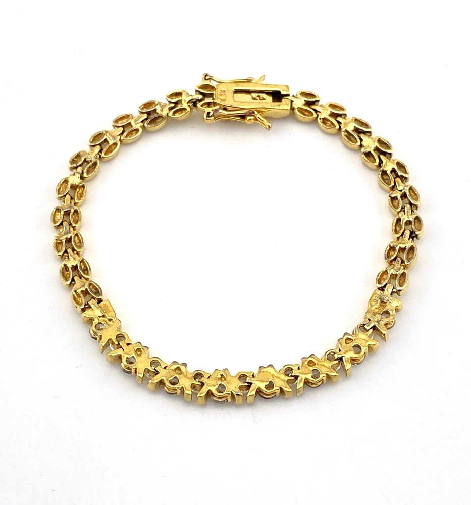 Gold over sterling silver bracelet with cubic zirconia stones panther link design 7 inch