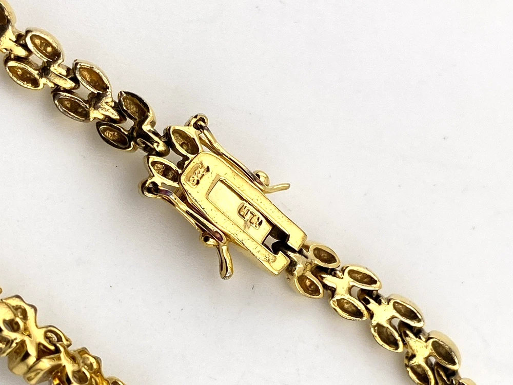 Gold over sterling silver bracelet with cubic zirconia stones panther link design 7 inch