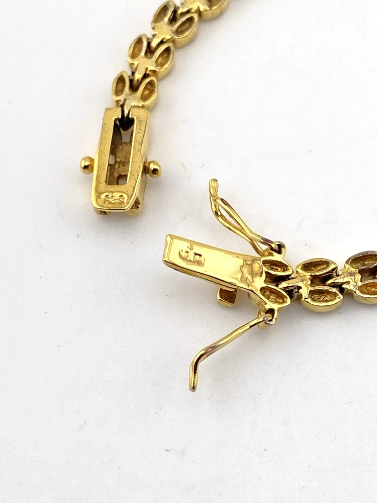 Gold over sterling silver bracelet with cubic zirconia stones panther link design 7 inch