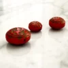 Three bold Czech glass beads with Egyptian Revival motifs—small, sculptural, and full of 1920s character.