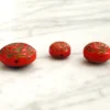 Three bold Czech glass beads with Egyptian Revival motifs—small, sculptural, and full of 1920s character.