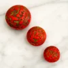 Three bold Czech glass beads with Egyptian Revival motifs—small, sculptural, and full of 1920s character.