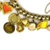 Vintage gold filled charm bracelet with fifteen locket charms including hearts book and enamel designs