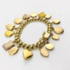 Vintage gold filled charm bracelet with fifteen locket charms including hearts book and enamel designs
