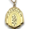 Edwardian gold filled shield shaped locket necklace with floral engraved front, pinstripe back, antique photo inside, and 21 inch chain