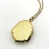 Edwardian gold filled shield shaped locket necklace with floral engraved front, pinstripe back, antique photo inside, and 21 inch chain