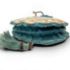 Antique Art Nouveau era mother-of-pearl and blue silk necessaire purse with scalloped shell panels, rope handles, and tassel.