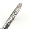 Antique P&H sterling silver bangle bracelet with carved scrolls, vines, leaves, and forget-me-not flowers.