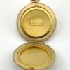 Antique Hayward 1/20 12K gold filled round photo locket with chased shield cover, floral garland, pinstripe back, and interior photo frames
