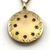 Antique Victorian gold filled round locket necklace with paste stone edging, bloomed gold finish, engraved EM monogram, and 21 inch chain