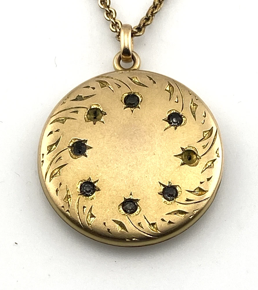 Antique Victorian gold filled round locket necklace with paste stone edging, bloomed gold finish, engraved EM monogram, and 21 inch chain