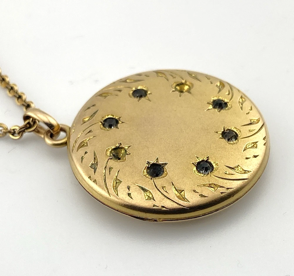 Antique Victorian gold filled round locket necklace with paste stone edging, bloomed gold finish, engraved EM monogram, and 21 inch chain