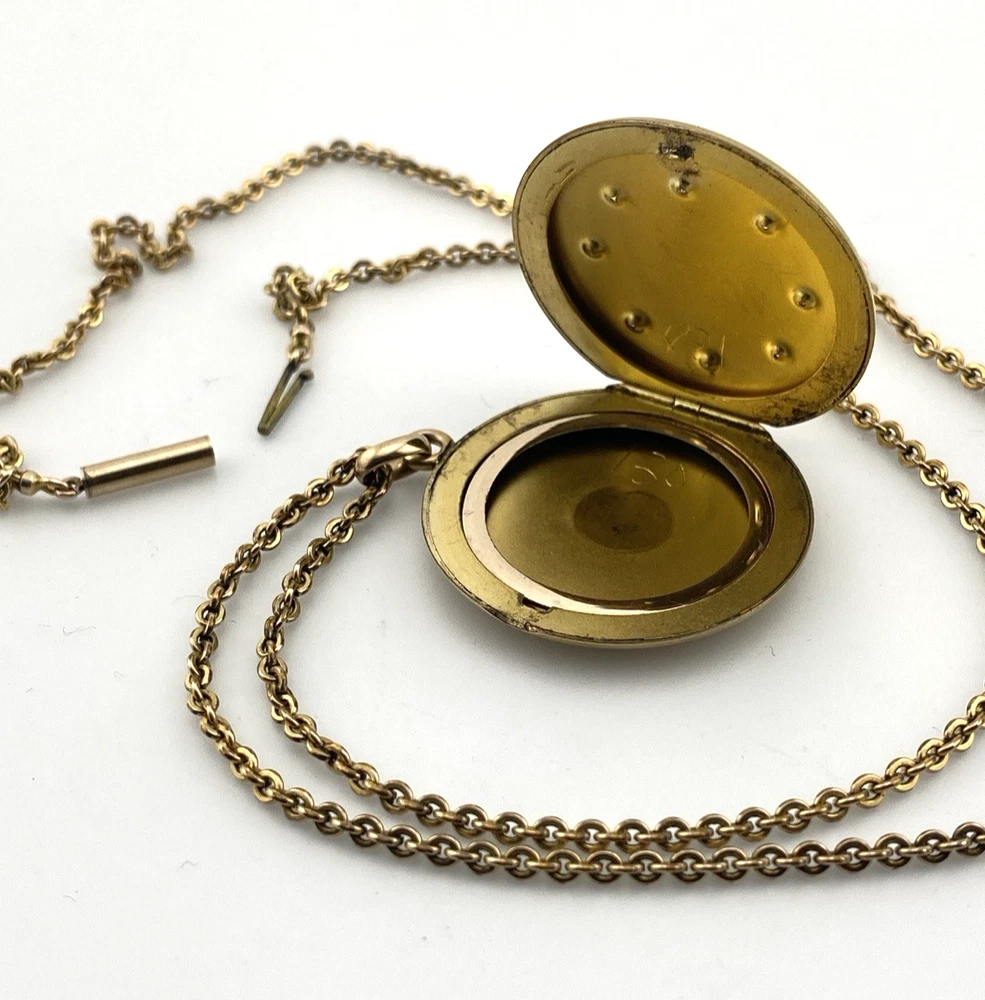 Antique Victorian gold filled round locket necklace with paste stone edging, bloomed gold finish, engraved EM monogram, and 21 inch chain