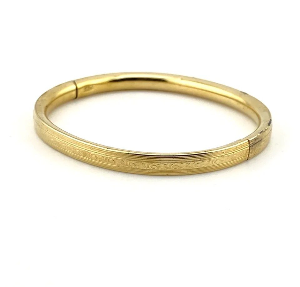 Ballou child’s size 1/20 12K gold filled hinged bangle bracelet with engraved parallel line texture and raised scrolled center