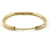 Ballou child’s size 1/20 12K gold filled hinged bangle bracelet with engraved parallel line texture and raised scrolled center