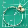 Child’s size sterling silver bangle bracelet with jingling bell charms, crescent moon and star design, marked 925