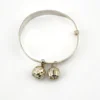 Child’s size sterling silver bangle bracelet with jingling bell charms, crescent moon and star design, marked 925