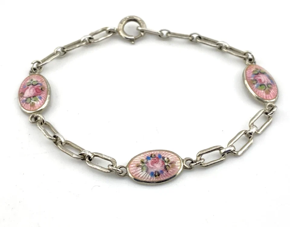 Child’s size 1940s sterling silver bracelet with pink guilloché enamel rose stations and squared oval links