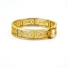 Left side of Antique gold filled filigree clamper bracelet with hand carved shell cameo and hidden clasp