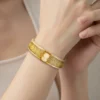 second view of Antique gold filled filigree clamper bracelet with hand carved shell cameo and hidden clasp