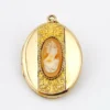 Edwardian gold filled Binder Bros oval locket with hand carved shell cameo and engraved center panel