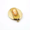Edwardian gold filled Binder Bros oval locket with hand carved shell cameo and engraved center panel