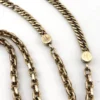 Gold filled repurposed pocket watch chain necklace with pink jeweled fob charm and mixed chain links