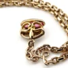 Gold filled repurposed pocket watch chain necklace with pink jeweled fob charm and mixed chain links