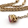 Gold filled repurposed pocket watch chain necklace with pink jeweled fob charm and mixed chain links