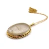 Gold rutilated quartz pendant necklace with oval cabochon and 12k rolled gold chain

8) Short Description