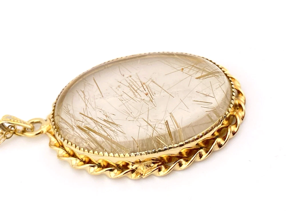 Gold rutilated quartz pendant necklace with oval cabochon and 12k rolled gold chain
8) Short Description