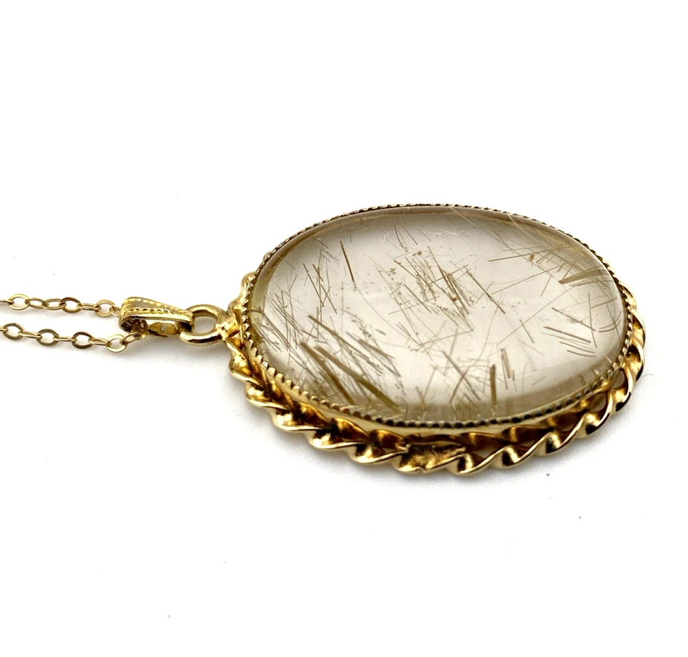 Gold rutilated quartz pendant necklace with oval cabochon and 12k rolled gold chain
8) Short Description
