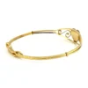 Signed Kiddie Kraft 1/20 12K gold filled sweetheart bangle bracelet with guilloche enamel heart, pink rose, and green leaves