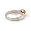 Vintage Modernist sterling silver ring with a round honey colored Baltic amber cabochon.