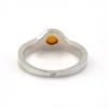 Vintage Modernist sterling silver ring with a round honey colored Baltic amber cabochon.