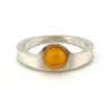 Vintage Modernist sterling silver ring with a round honey colored Baltic amber cabochon.