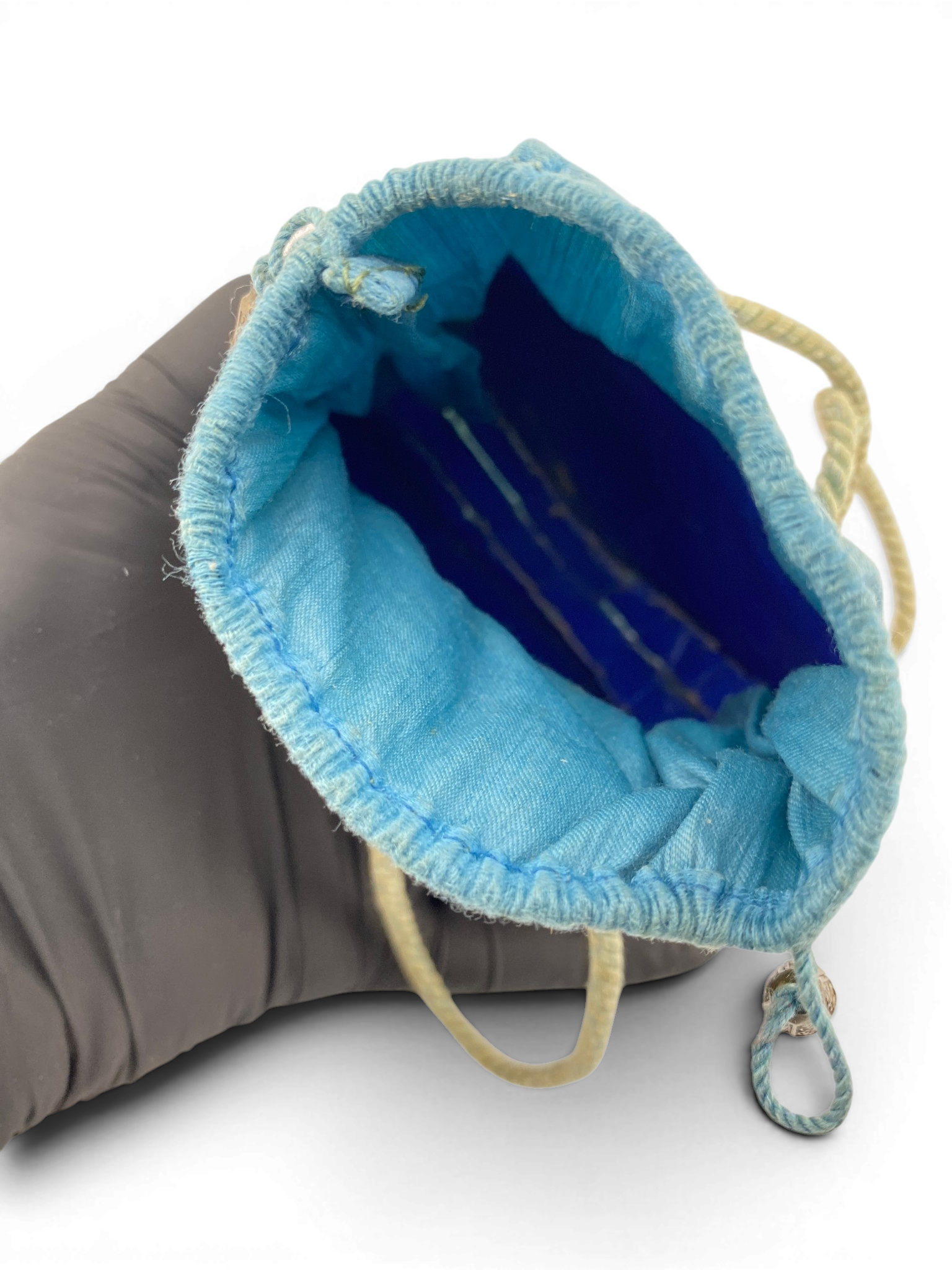 Antique Art Nouveau era mother-of-pearl and blue silk necessaire purse with scalloped shell panels, rope handles, and tassel.