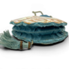 Antique Art Nouveau era mother-of-pearl and blue silk necessaire purse with scalloped shell panels, rope handles, and tassel.