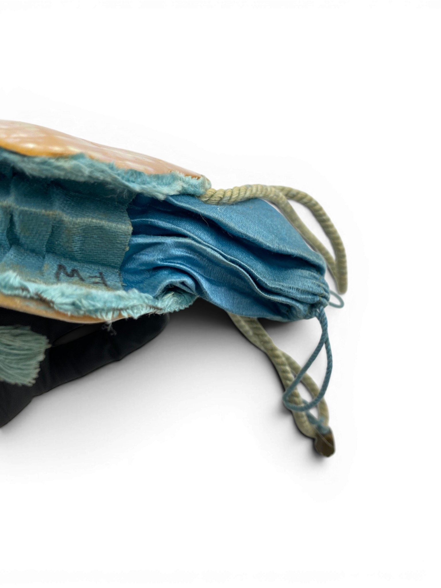 Antique Art Nouveau era mother-of-pearl and blue silk necessaire purse with scalloped shell panels, rope handles, and tassel.