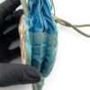 Antique Art Nouveau era mother-of-pearl and blue silk necessaire purse with scalloped shell panels, rope handles, and tassel.
