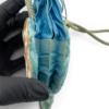Antique Art Nouveau era mother-of-pearl and blue silk necessaire purse with scalloped shell panels, rope handles, and tassel.