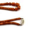 Detail image of center on tube coral necklace