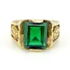 Vintage Mexican biker brass ring with green faceted glass stone and Our Lady of Guadalupe shoulders