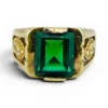 Vintage Mexican biker brass ring with green faceted glass stone and Our Lady of Guadalupe shoulders