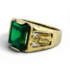 Vintage Mexican biker brass ring with green faceted glass stone and Our Lady of Guadalupe shoulders